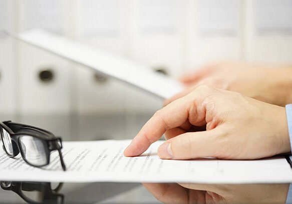 business people analyzing legal or financial document Comprehensive Assessment